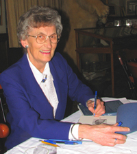 Mary autographing book