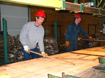 Placing sticks between layers of boards
